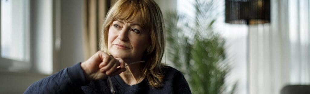 Woman looking our of the window and thinking