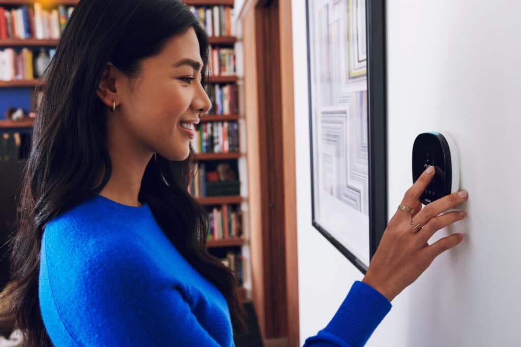 Woman using air conditioner