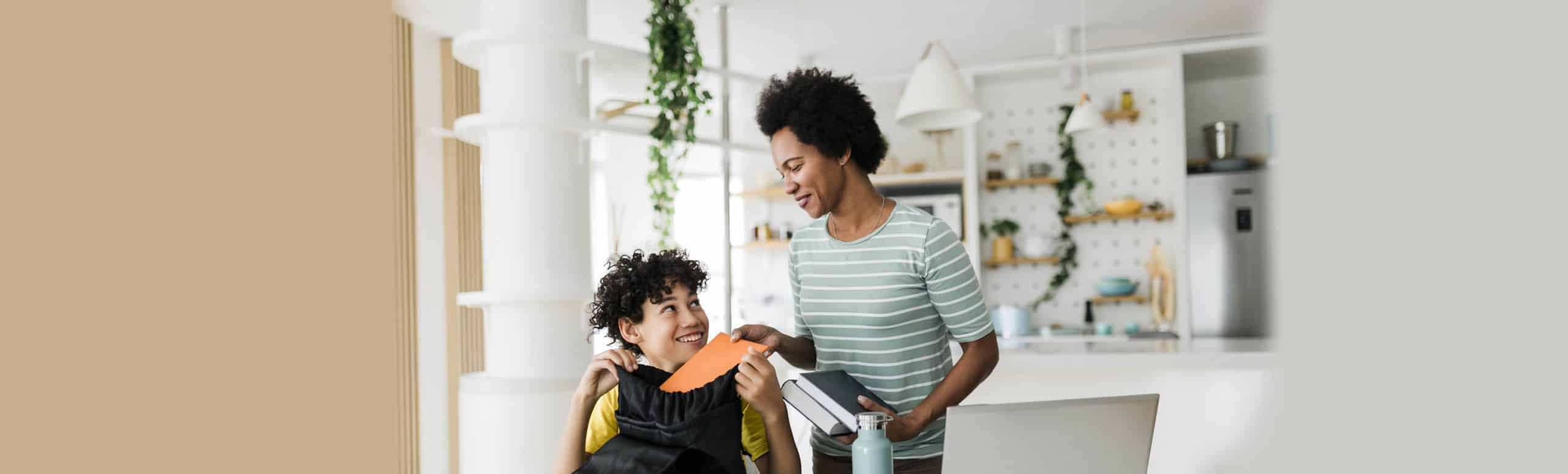 Mom and son getting ready for back to school at home