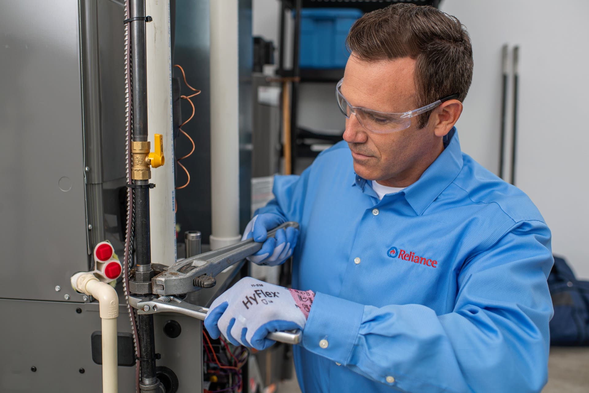 A technician repairing a furnace