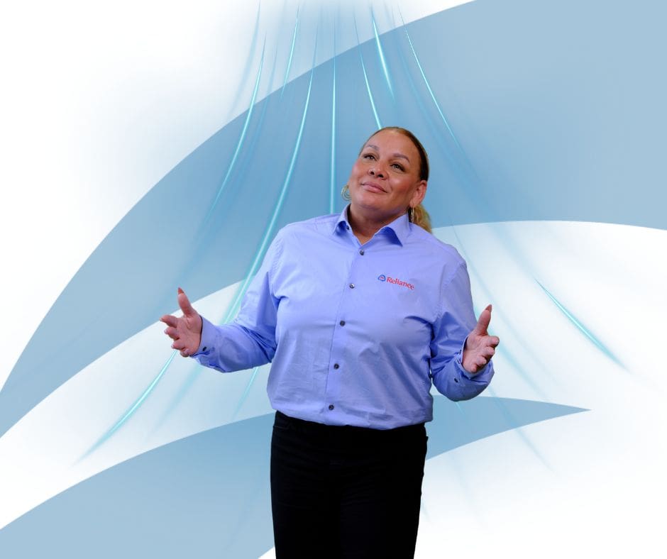 A Reliance technician breathes in a graphic of fresh air